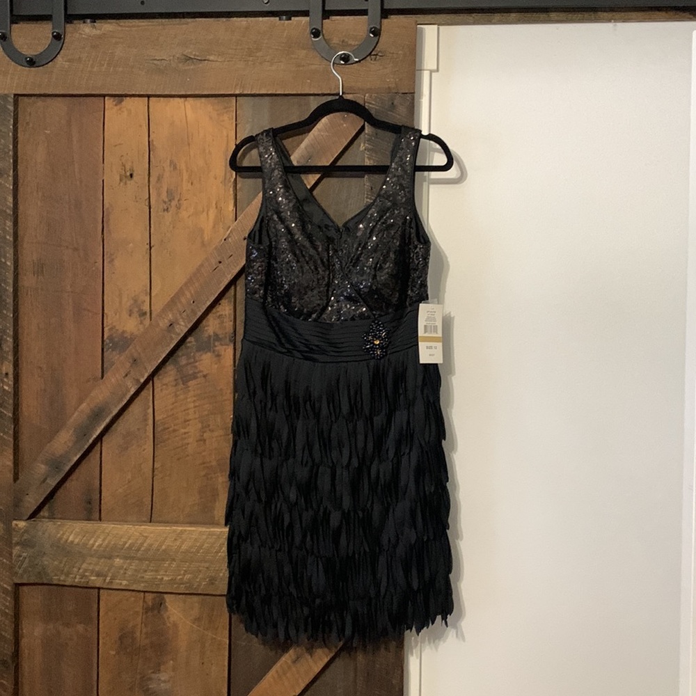 Ignite evenings by Carol Lin  knee length with sequined bodice